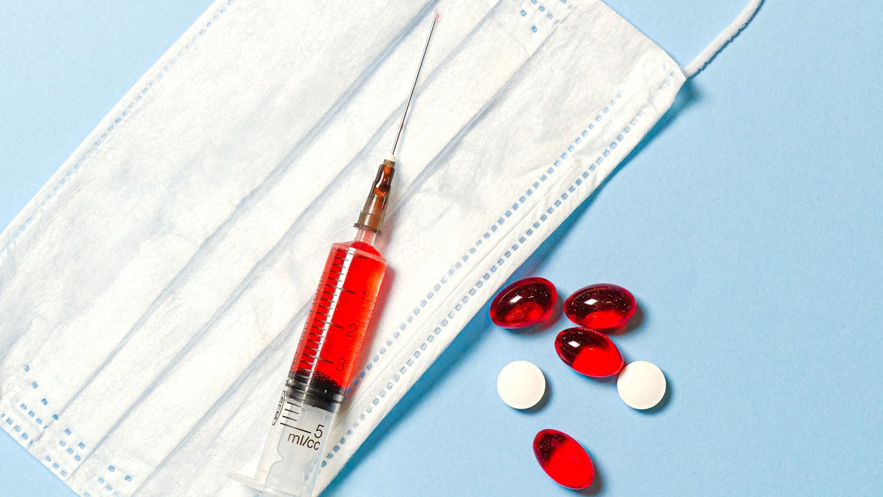 Close-up of supplement capsules and lab testing equipment representing quality verification