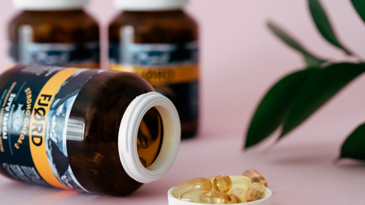 Glass supplement bottles with health supplements for longevity and metabolic health