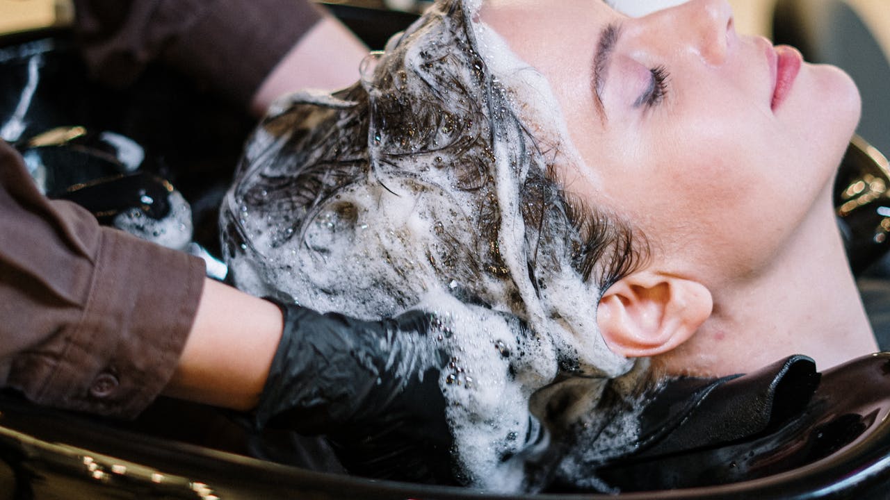 Close-up of hair and scalp health care routine