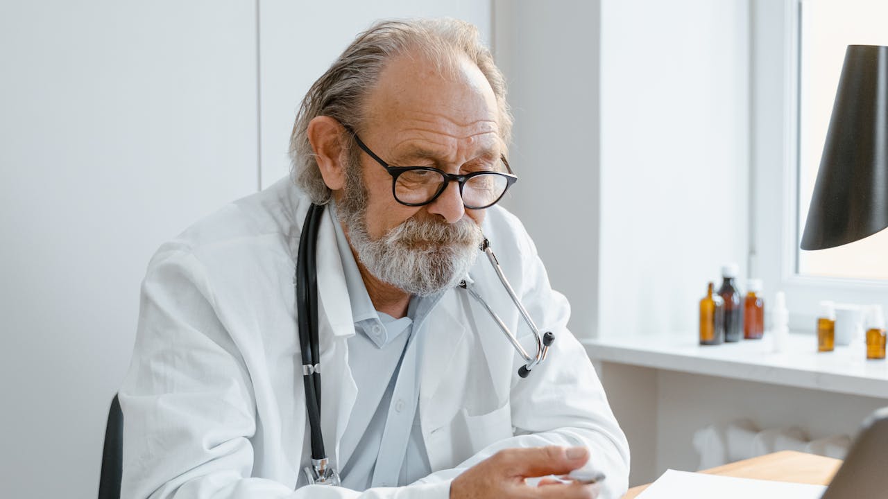 Doctor conducting a video consultation using a laptop computer