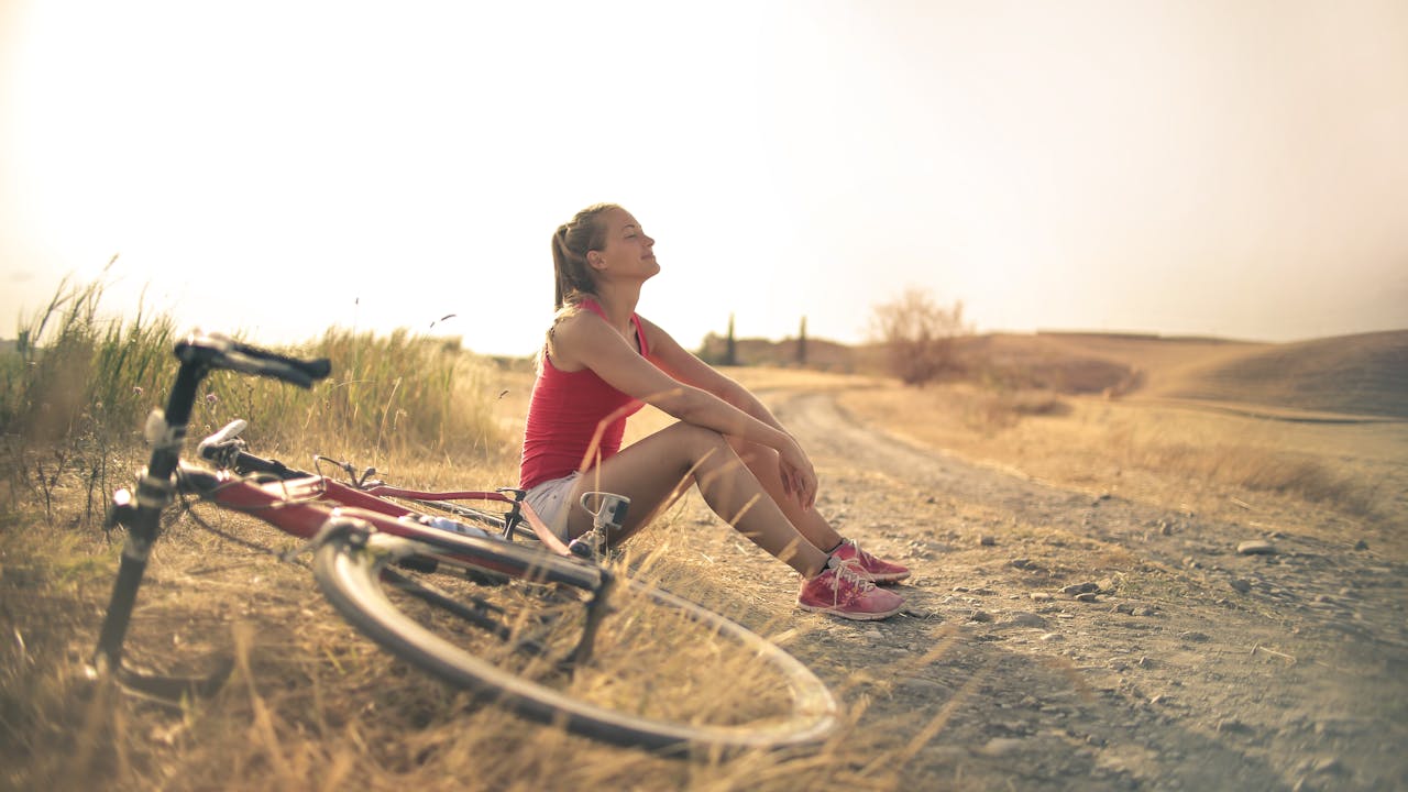 Person in morning sunlight, natural vitamin D synthesis through skin exposure