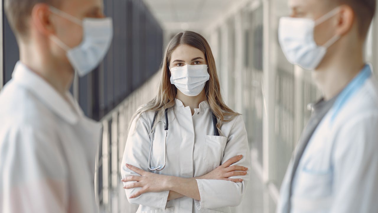 Person consulting with a pharmacist at a pharmacy counter