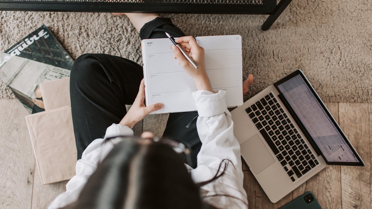 Person sitting at desk with clear focus and concentration, working productively