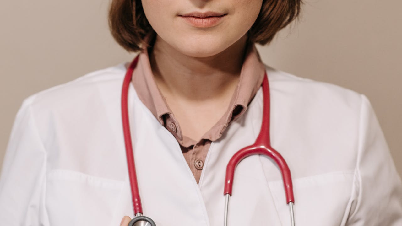 Doctor discussing treatment options with a patient in a clinical consultation setting