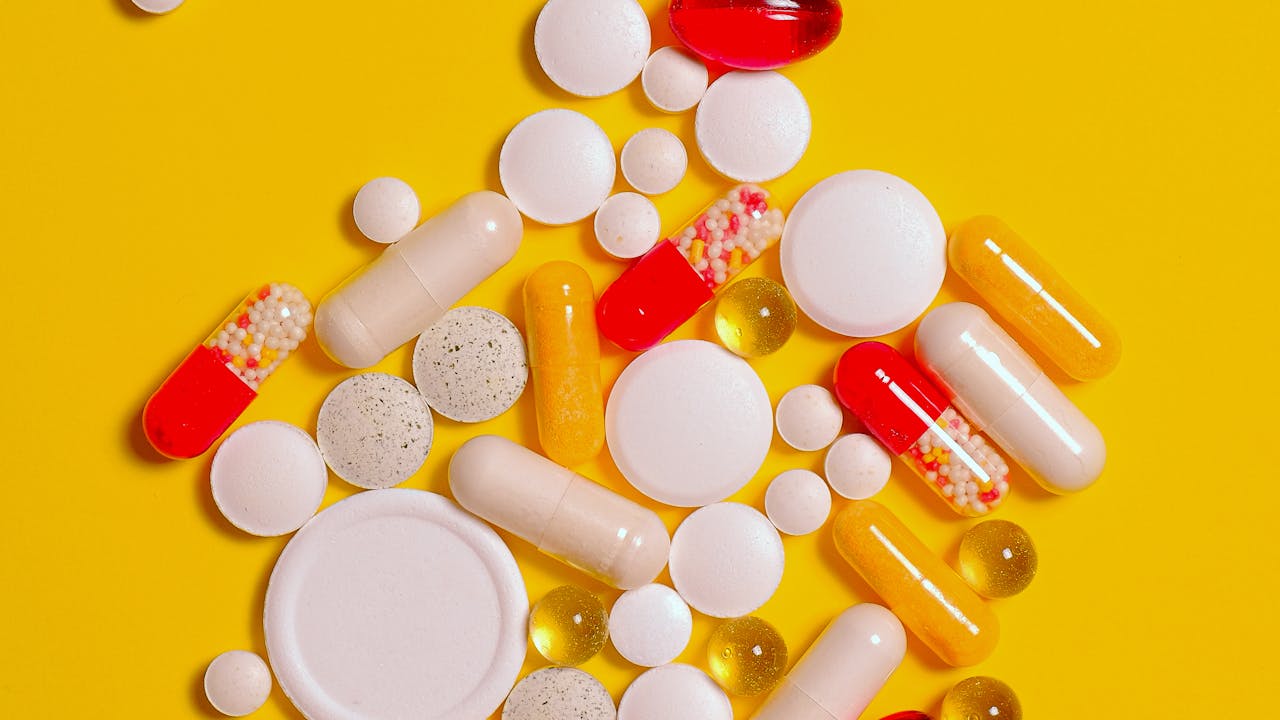 Supplement capsules on a surface representing daily berberine supplementation