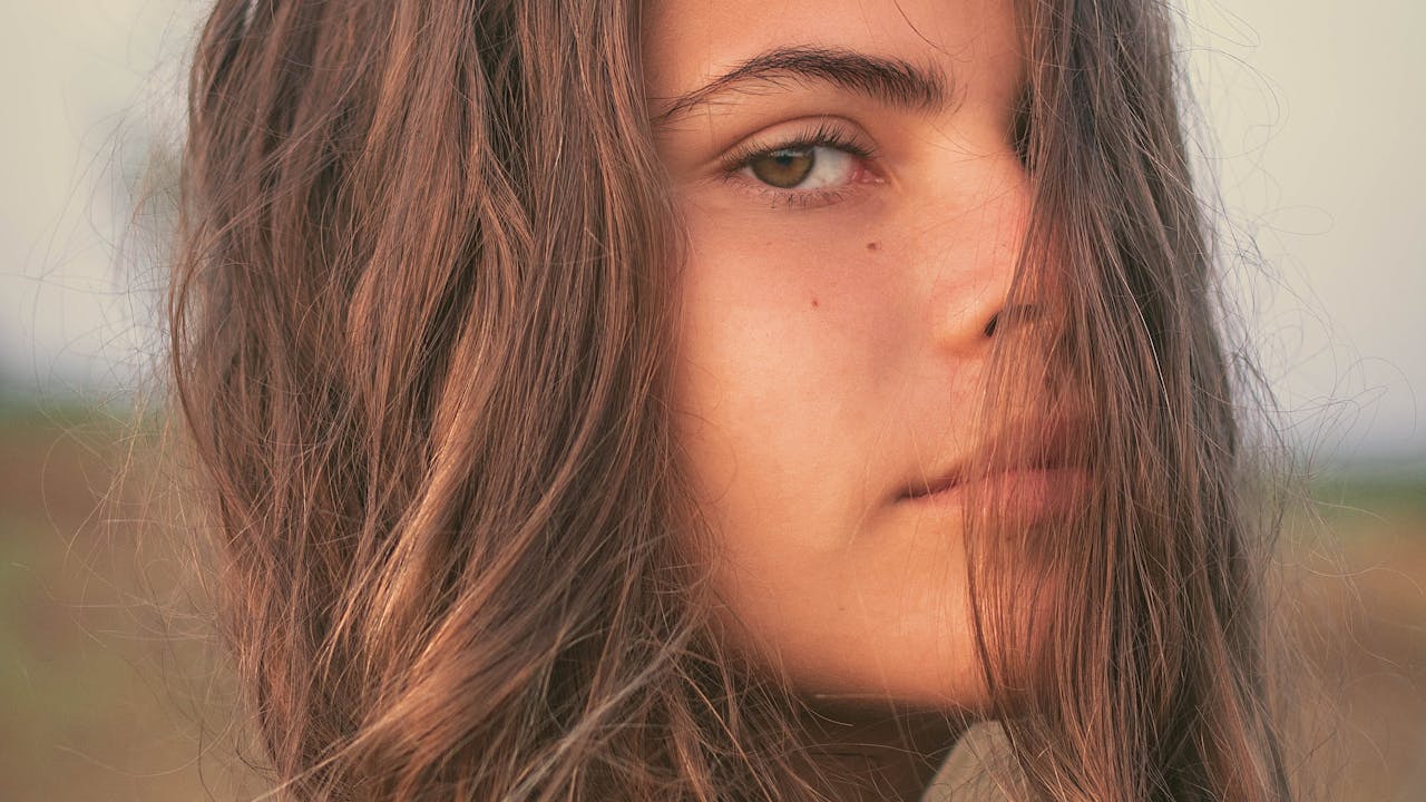 Woman with healthy, vibrant hair representing spermidine's hair growth benefits